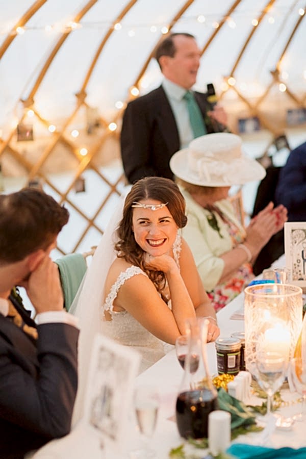 bride smiling to groom during father
