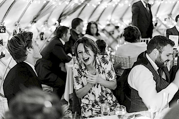 guests laughing at speeches 