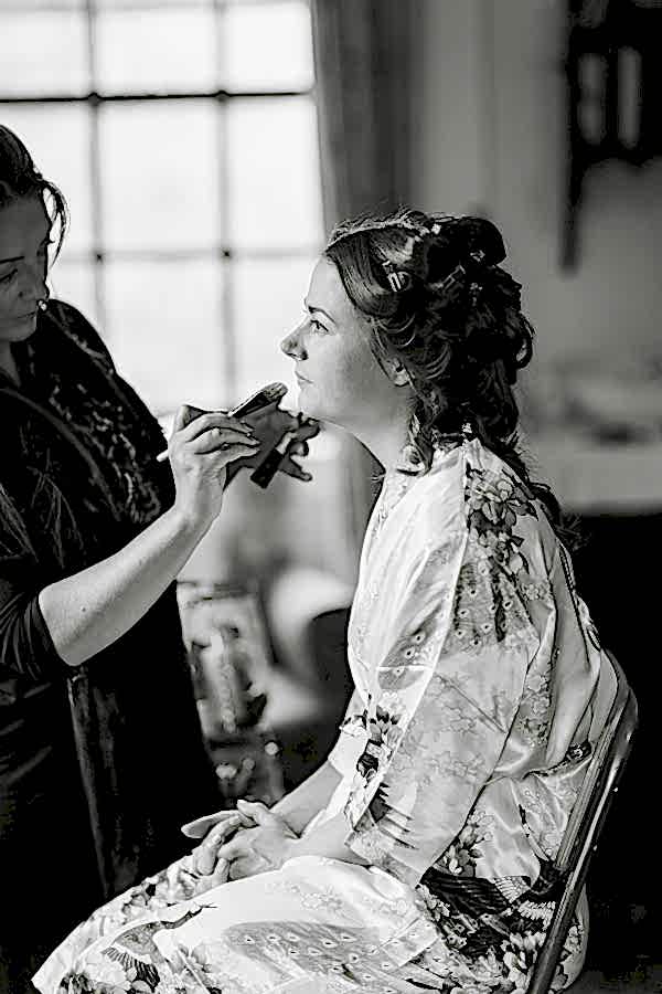 laura grey make-up artist with bride during preparations at ardkinglas