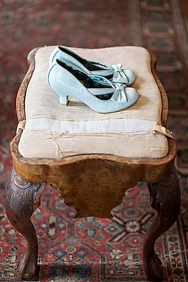 blue weddign shoes on a vintage stool