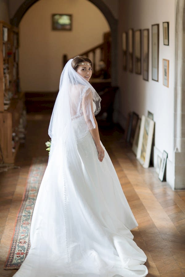 bride waling down corridor at ardkinglas wedding venue