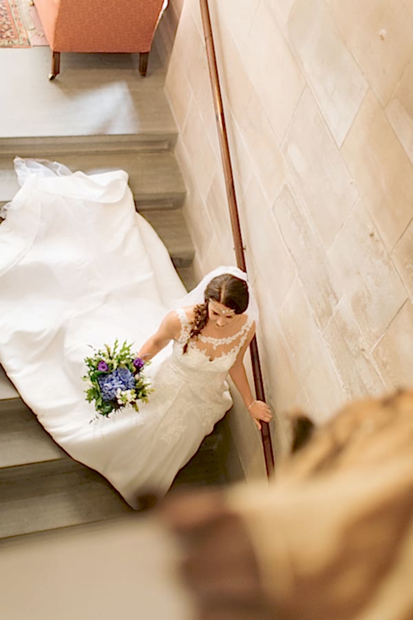 bride walking down the stairs leaving for ceremony