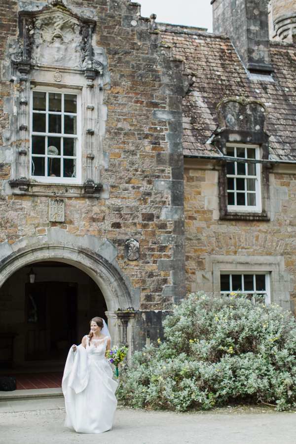 bride at the main entrance to ardkinglas 