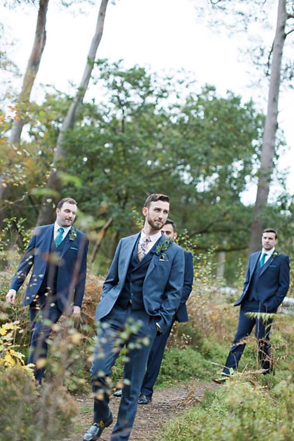 groom with groomsmen walking down to ceremony