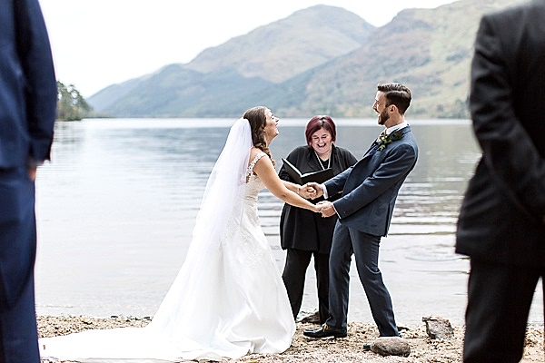 bride and groom holding hands during weddign ceremony