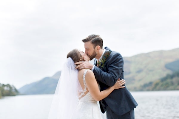 bride and groom kissing during ceremony scotland