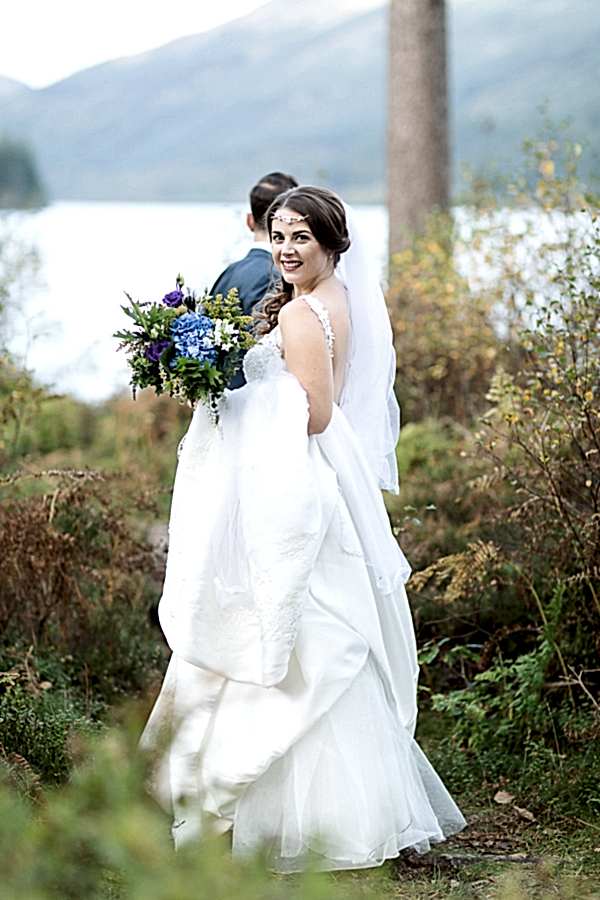 groom is pulling bride away from wedding photographer glasgow