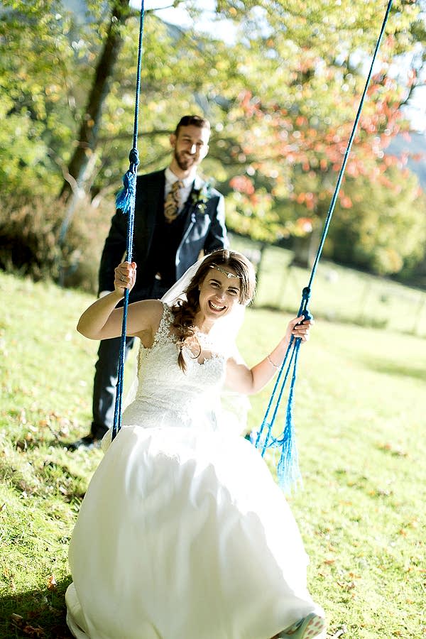 weddign photographer glasgow bride laughing on a swing 