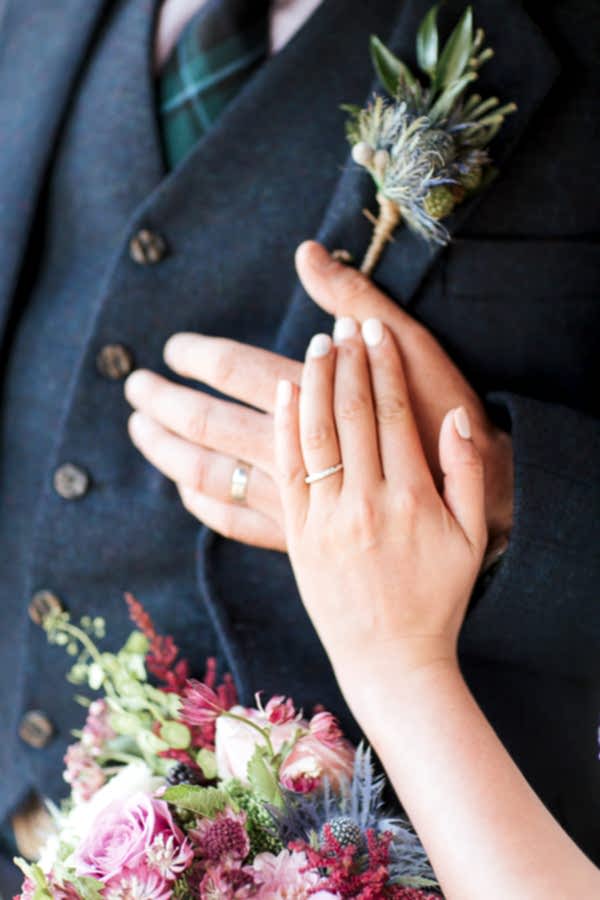 hands with weddings rings