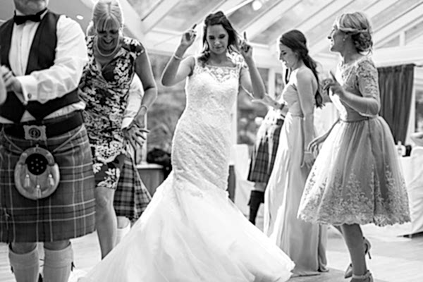 bride dancing with guests at the lodge on loch goil