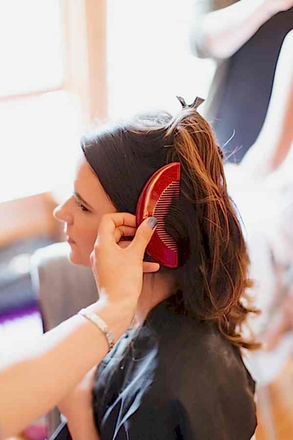 bride having her hair combed