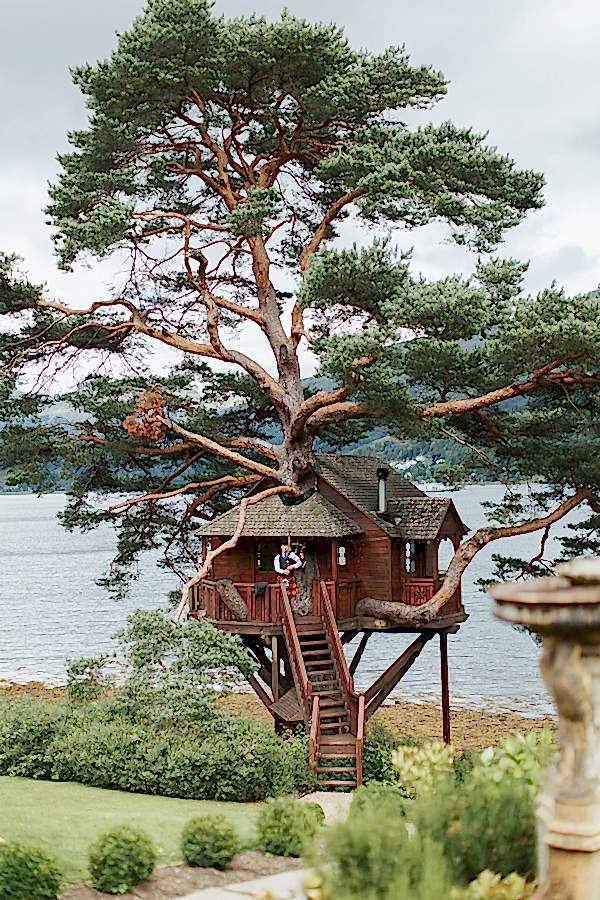 tree house at the lodge on loch goil scottish wedding venue with piper
