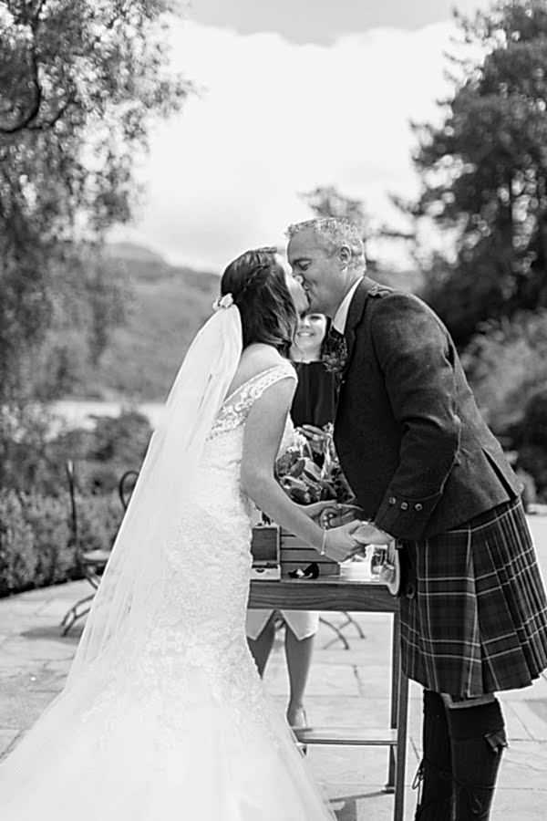 first kiss during ceremony at the lodge on loch goil