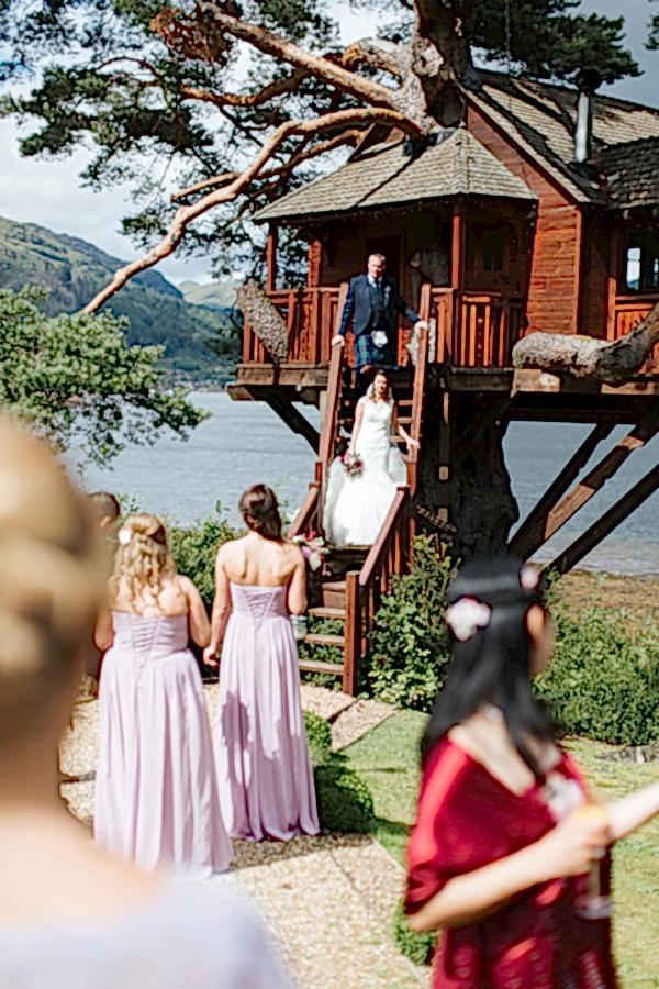 bride and groom at tree house over loch goil