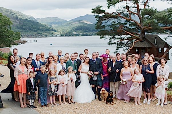 group shot of family and friends at the lodge on loch goil