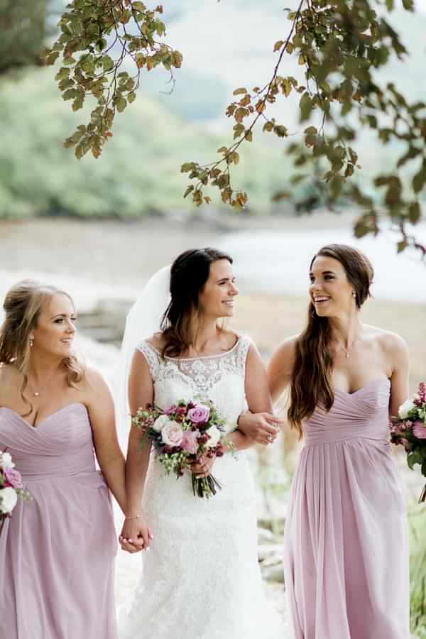 brides and bridesmates walking together