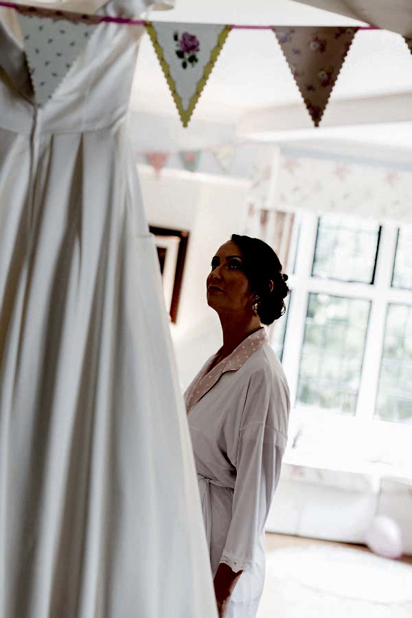 bride looking at her wedding dress bearsden glasgow