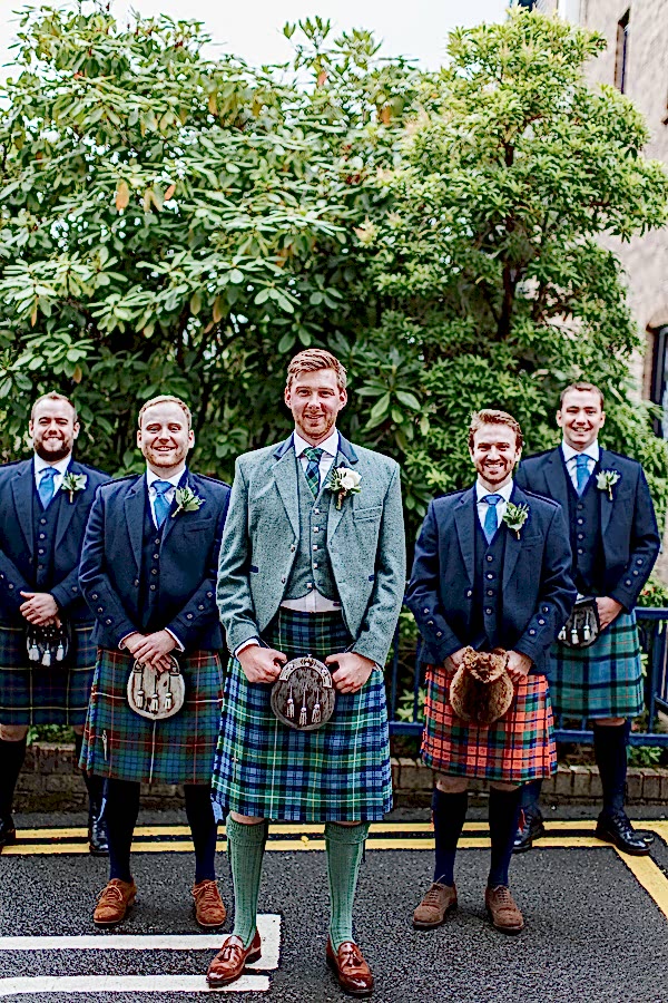 groom with ushers outside of the bearsden church glasgow