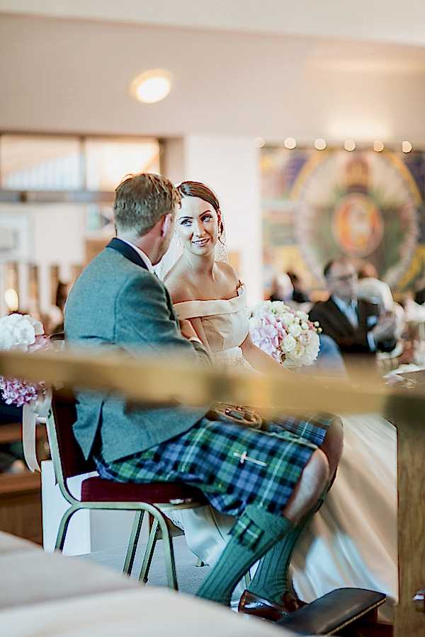 bride and groom looking at each other during ceremony