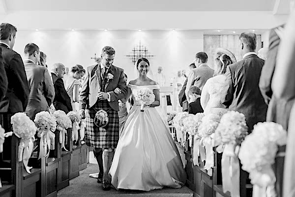 newlyweds walking down the aisle wedding photographer glasgow