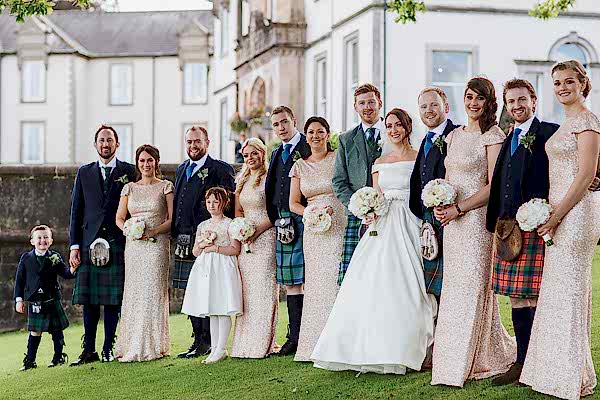 full bridal party in front of cameron house