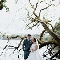 bride and groom next to fallen tree cameron house on loch lomond