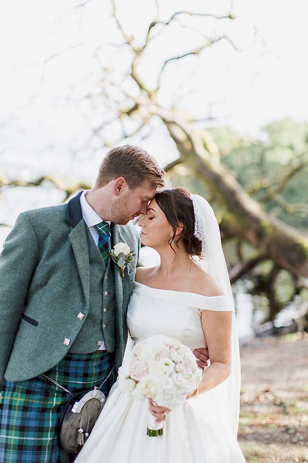 bride and groom clser together