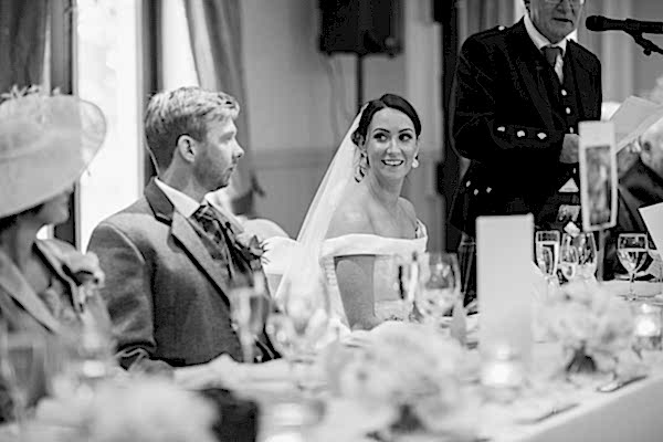 bride looking at groom during father
