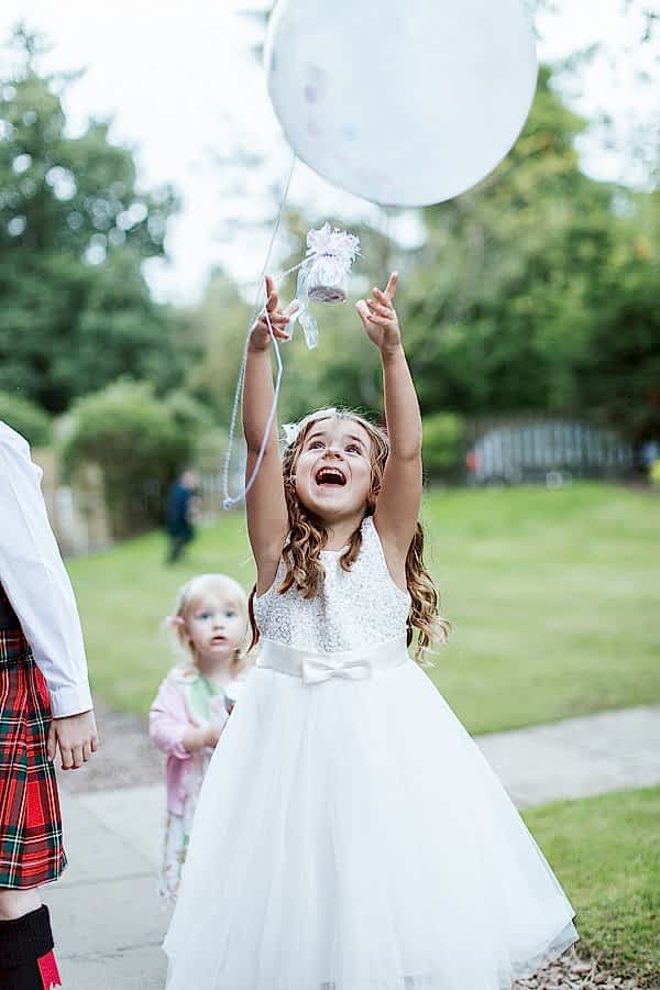 kids playing outside in the garden during wedding party