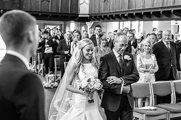 scottish bride arriving at the altar with her father scotland 