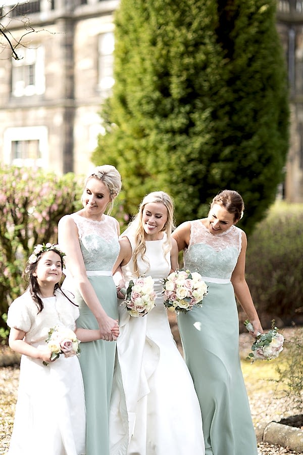 bride with her bridal party outside of mar hall scotland