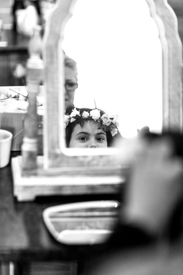 flower gril getting ready for a wedding in mar hall