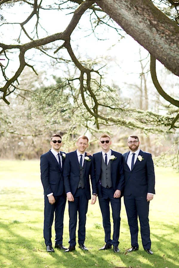 groom with his ushers posing for photos at the wedding in mar hall