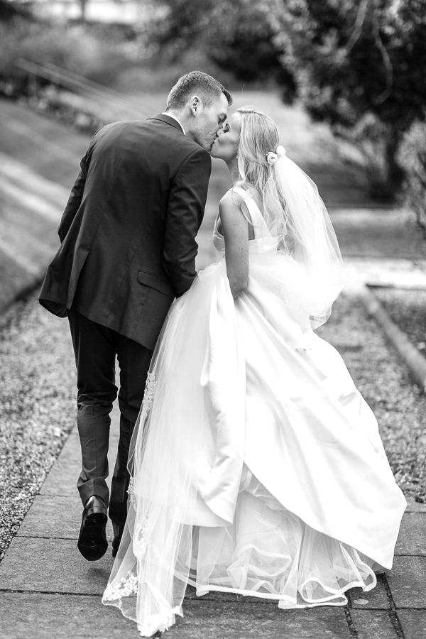 wedding couple kissing in the garden mar hall scotland 