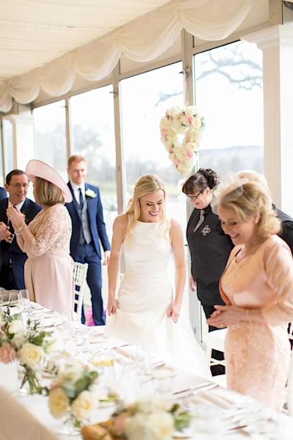 scottish bride taking her seat for a dinner scotland 