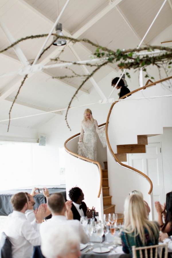 bride and groom walking down to reception