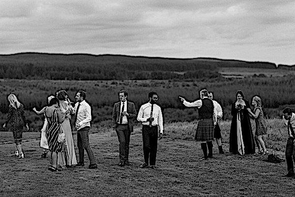 wedding guests in teh evening outdoors