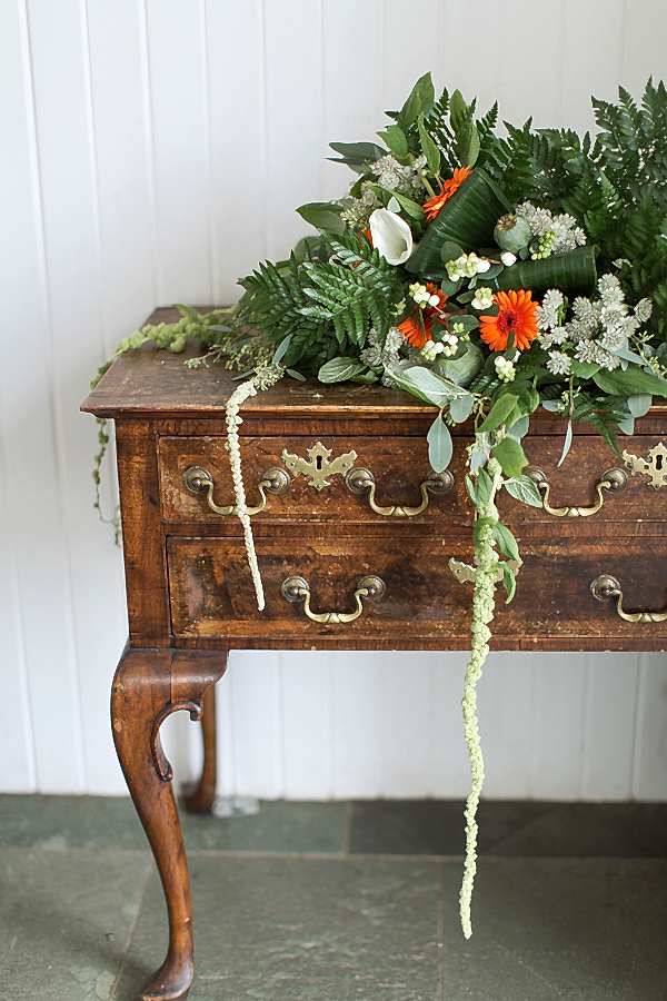 wedding flowers on a vintage chest at crear wedding venue