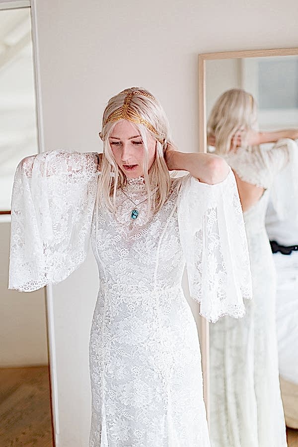 bride in her wedding dress 60s style with neckles