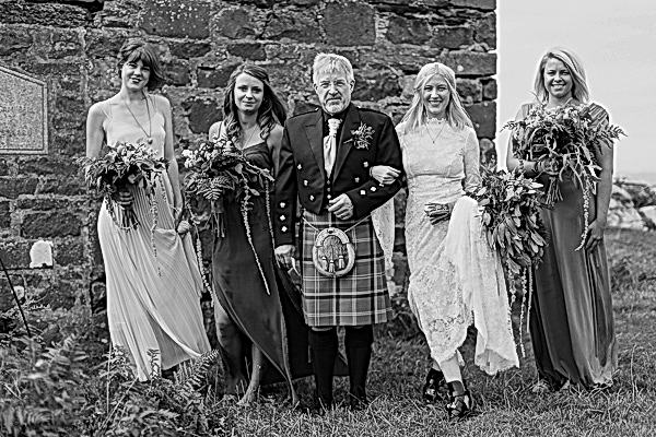 dad with bride and bridesmates just before ceremony