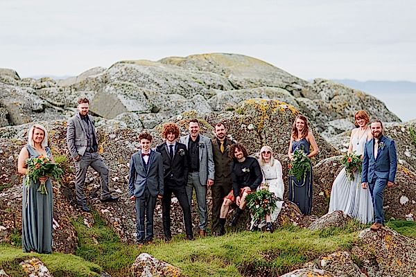 bridal party group shot with rocks wedding photos crear