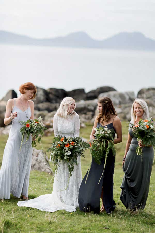 bridesmates and bride looking at each other and smiling