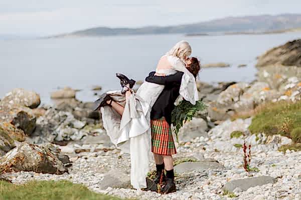 bride and groom kissing embraced at crear
