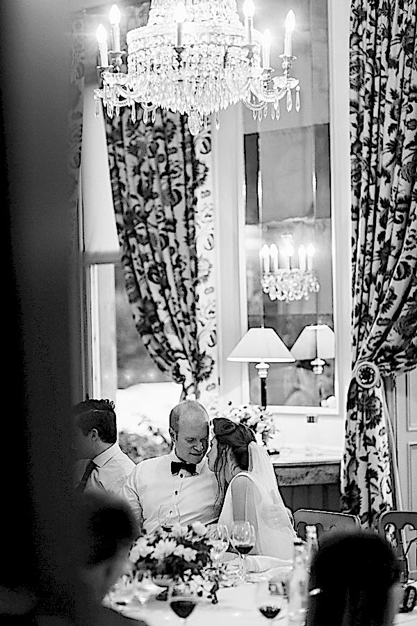 bride and groom talking at wedding dinner table at dundas castle