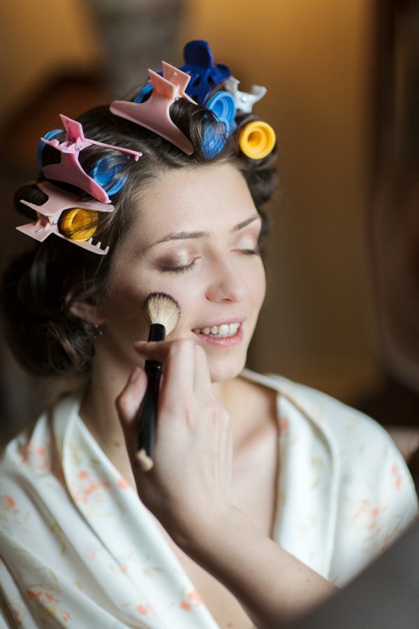 bride having her makeup done 