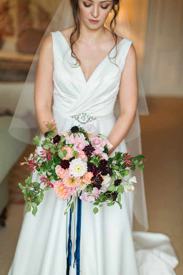 bride looking at her flowers just before ceremony