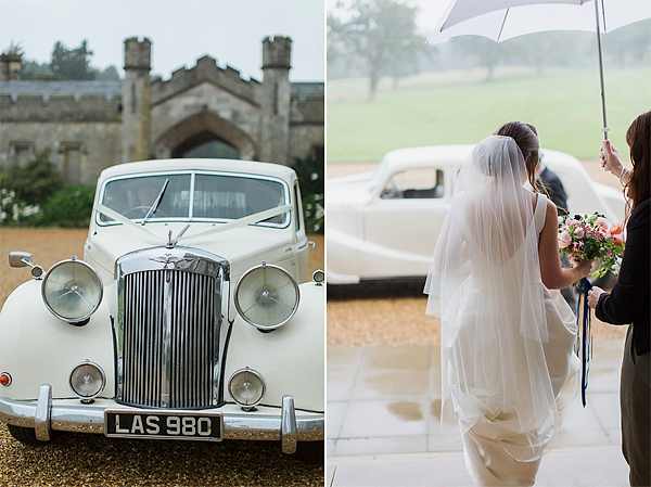 vintage wedding car and bride walking uder an umbrella