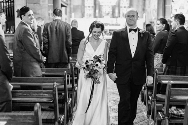 bride and groom walking the aisle together