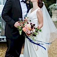 bride and groom kissing holding glasses dundas castle edinburgh