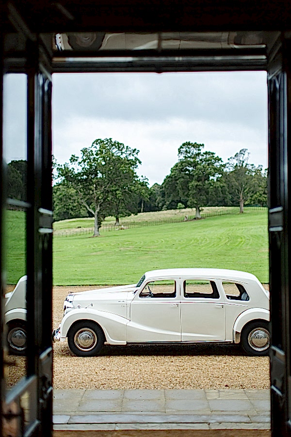 vintage wedding car parked in fron tof dundas castle scottish wedding venue